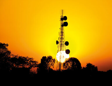 Sun sets behind African telecoms tower