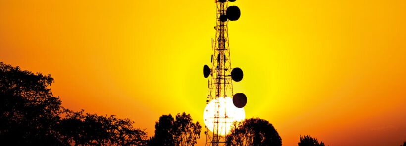 Sun sets behind African telecoms tower